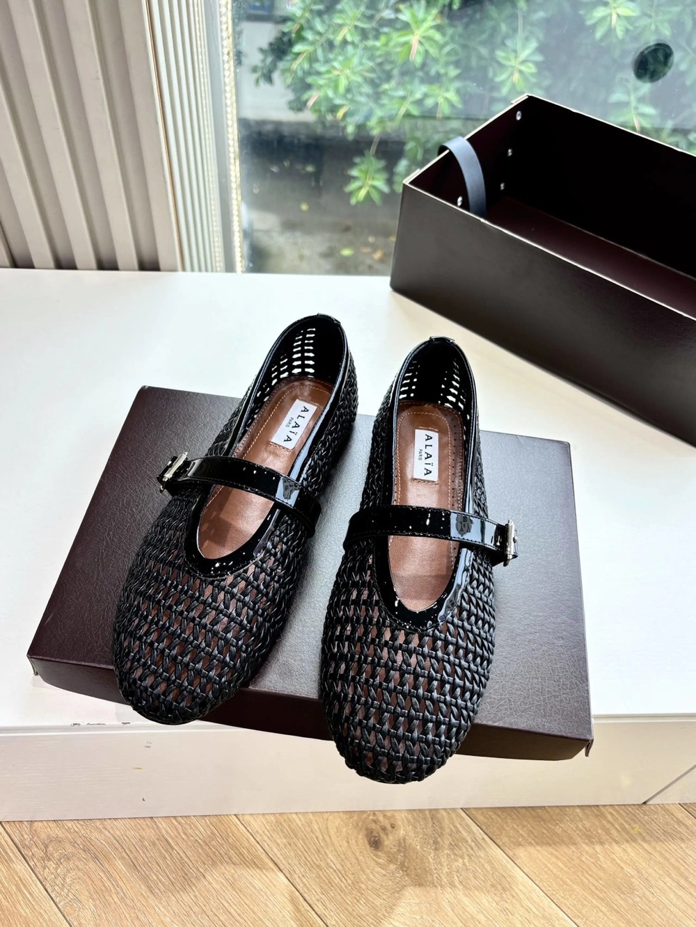 ALAÏA BALLET FLATS IN FISHNET BLACK